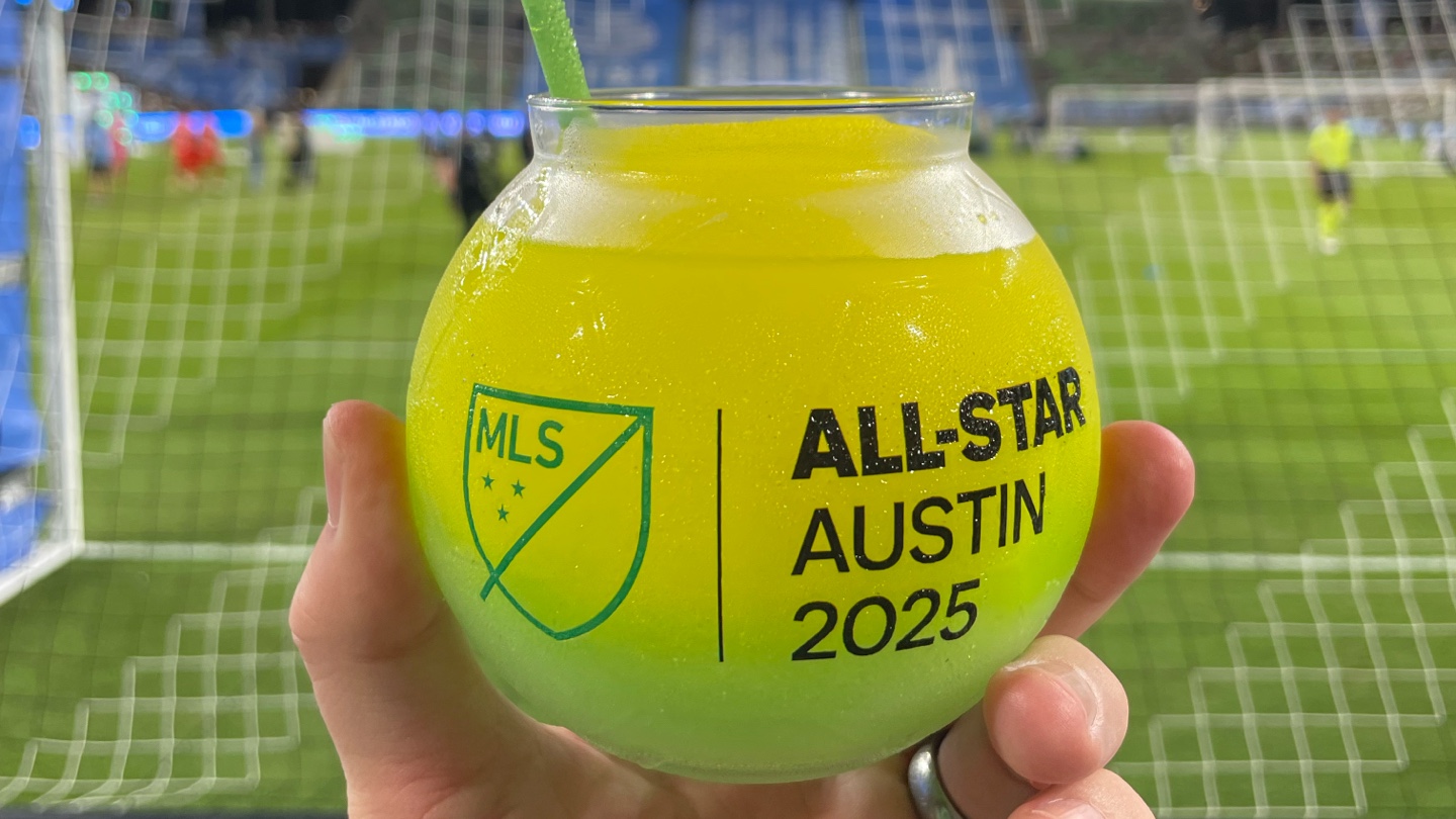 A round glass containing a frozen drink.