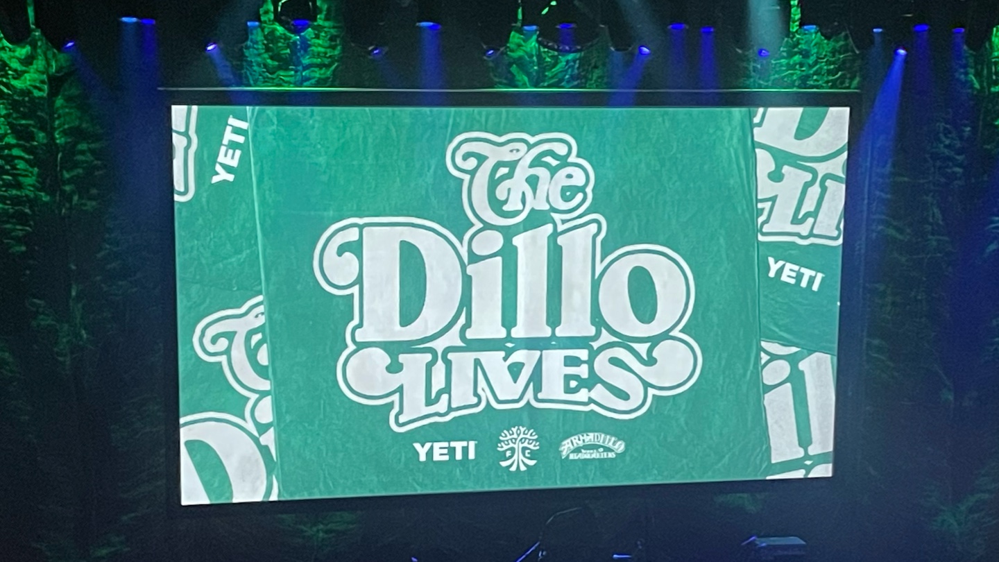 A screen at the Moody Theater showing "The 'Dillo Lives."