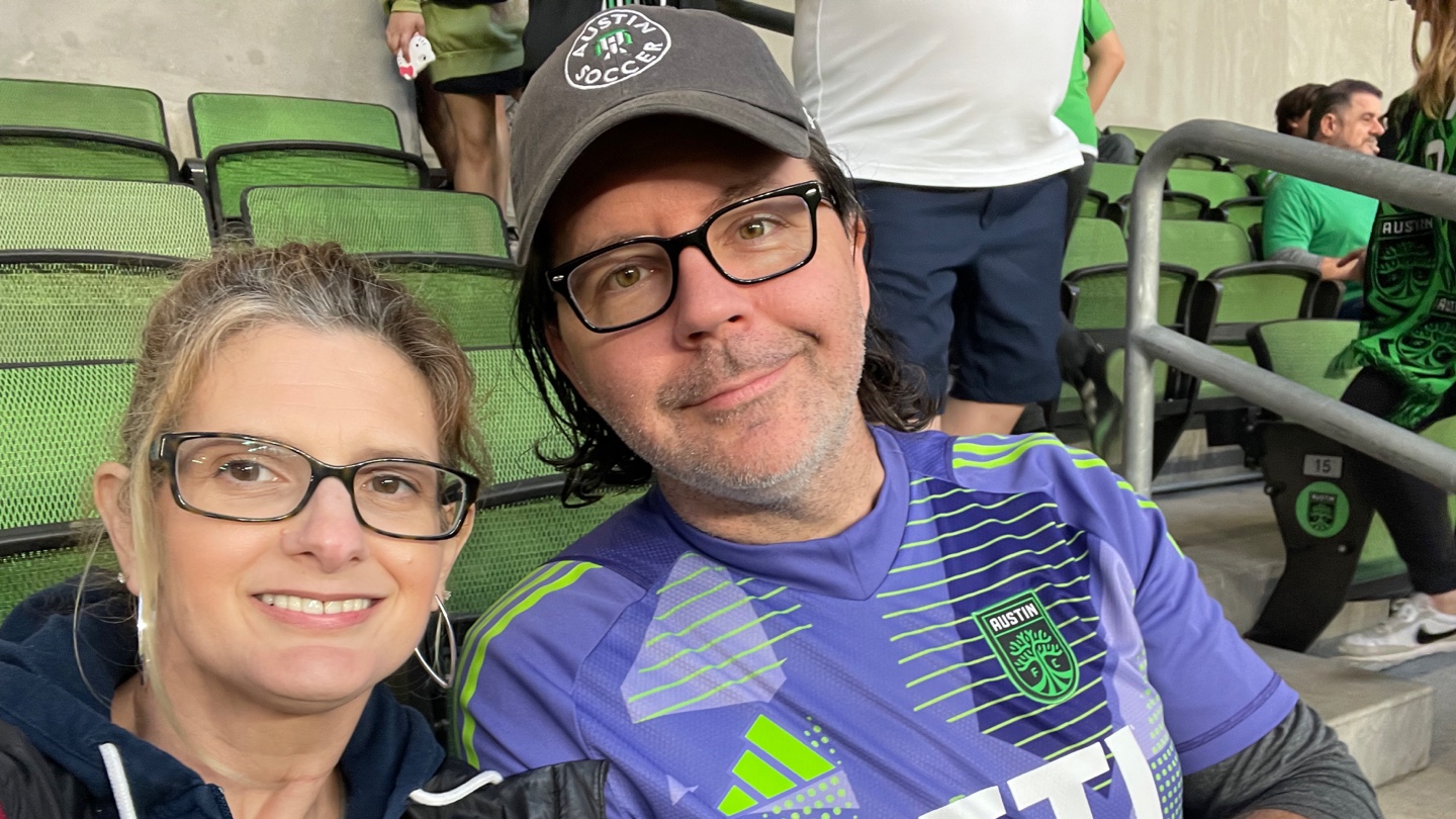 A couple in the stands of Q2 Stadium on matchday.